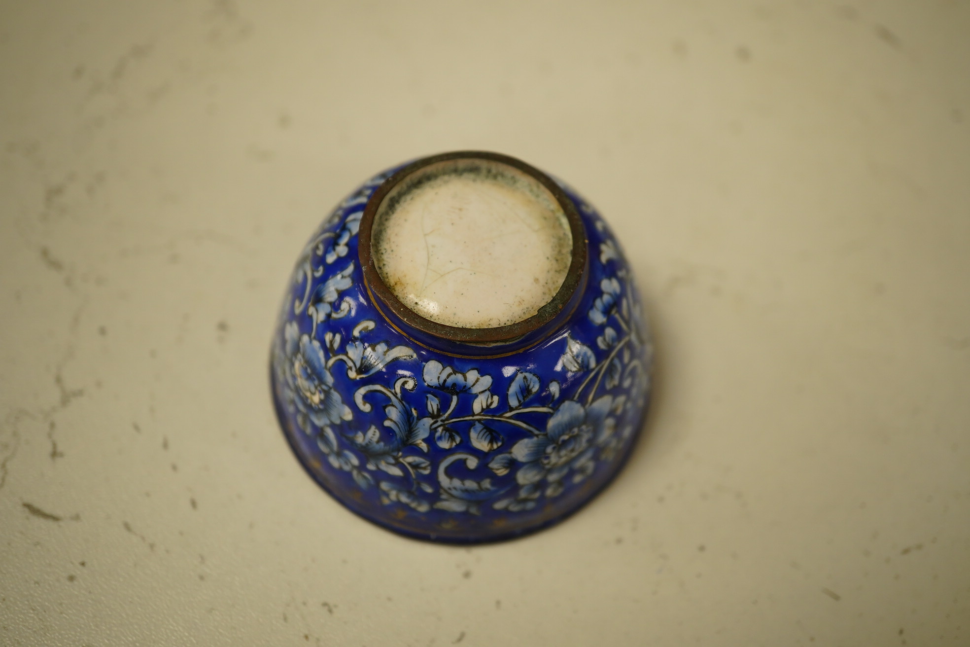 A group of Chinese blue and white porcelain, including a mid 19th century Canton enamel teabowl and a Japanese small dish, tallest 22cm. Condition - fair